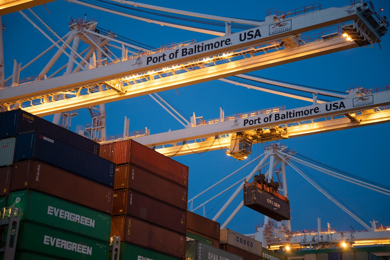 Cargo containers being handled at a terminal